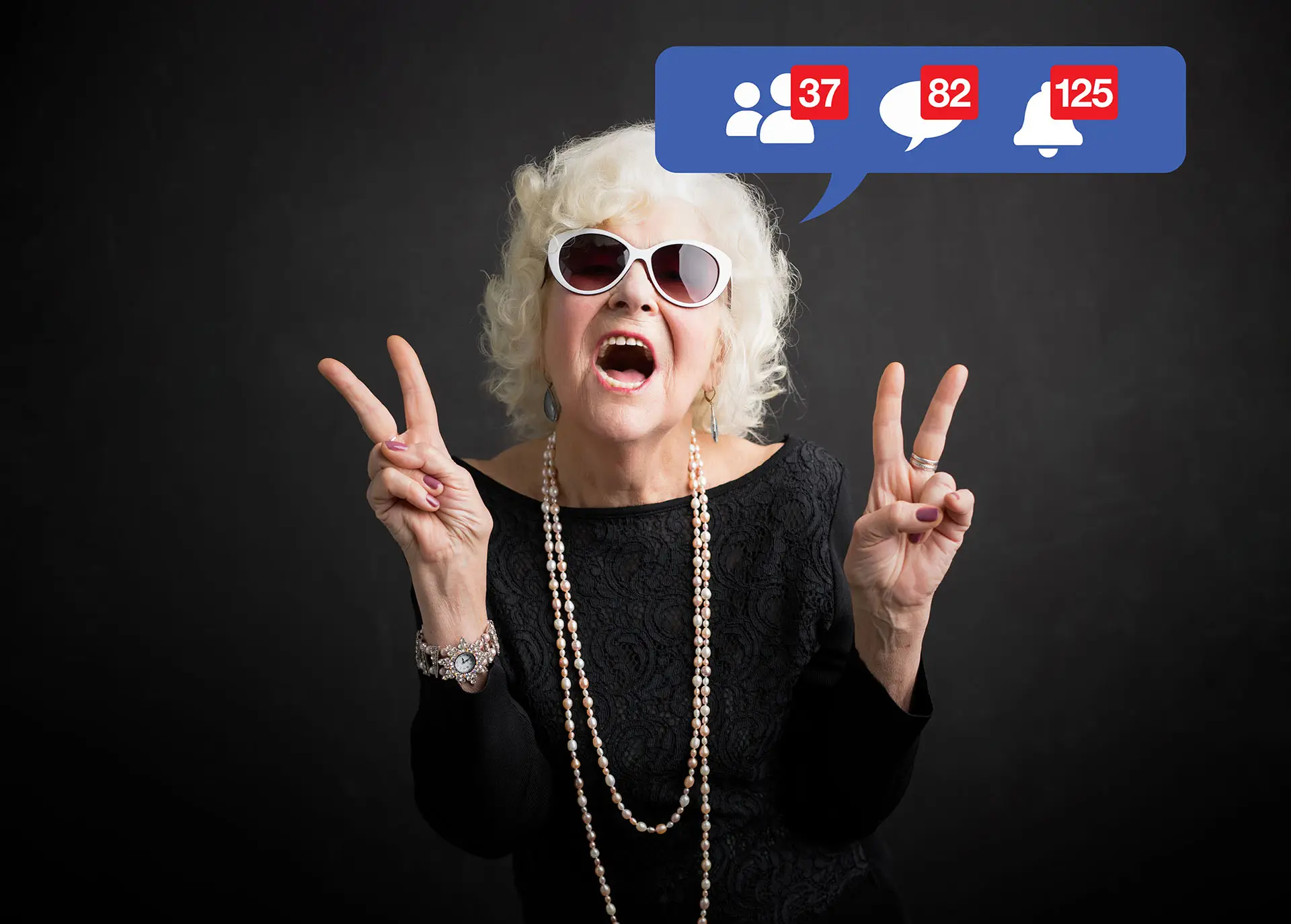 Digital Marketing for Small Businesses image shows an older lady doing the v sign for peace with both hands with social media icons around her - concept for Digital Marketing for Small Businesses and the diversity of the audience