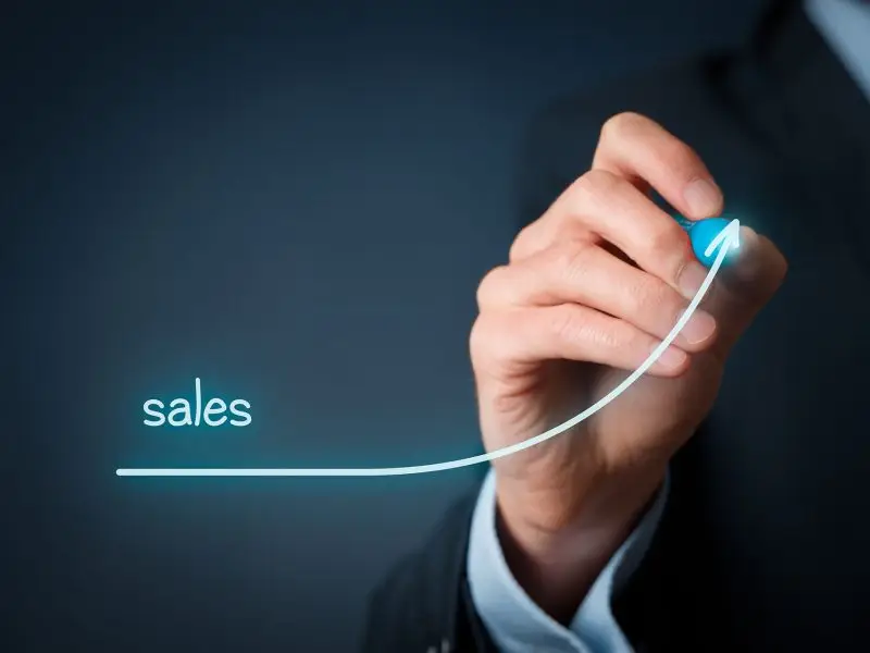 Selling for Beginners - this image shows a man's arm drawing an upward curve with the title sales.