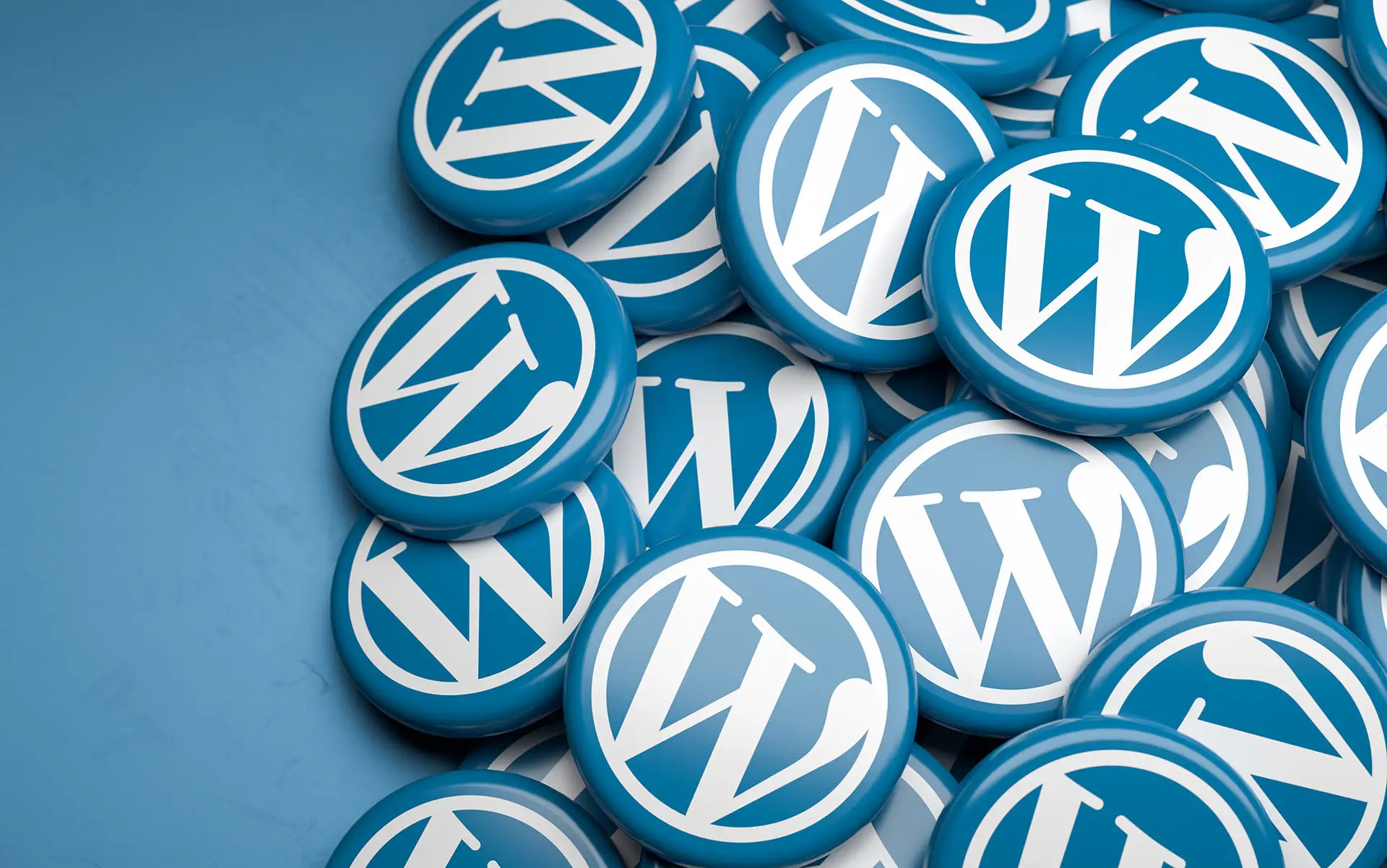 Top 10 Reasons to Have a WordPress Website the image shows a blue background with the WordPress icon appearing on button like discs