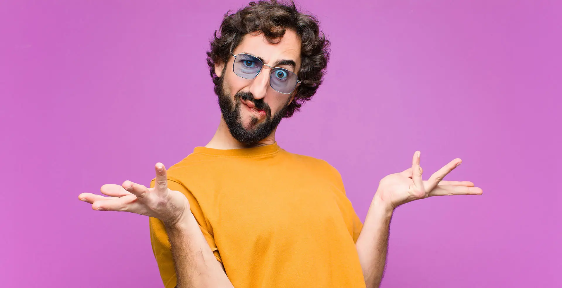 What Makes Great Website Content, the image shows a vivid purple background with a man in the foreground in a yellow t shirt shrugging