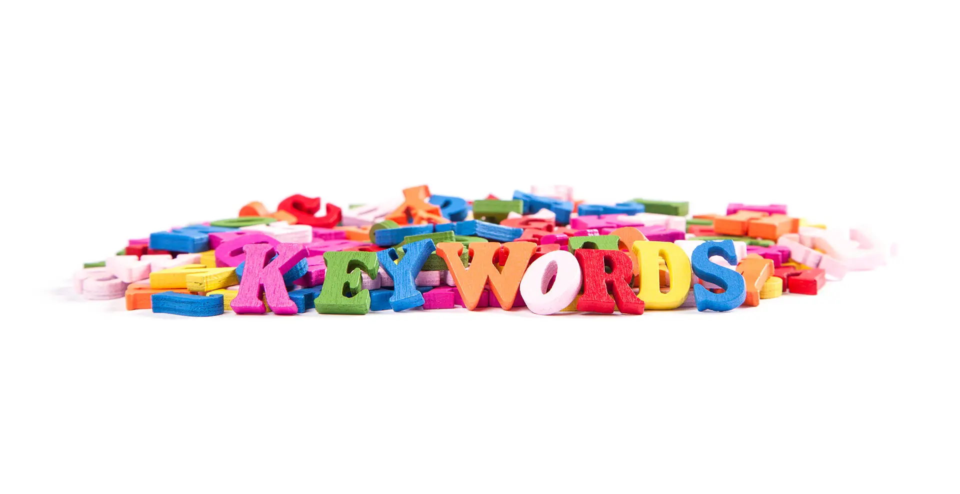 What is a Keyword Research? Image shows a pile of brightly coloured letters with "keywords" spelled out at the fore