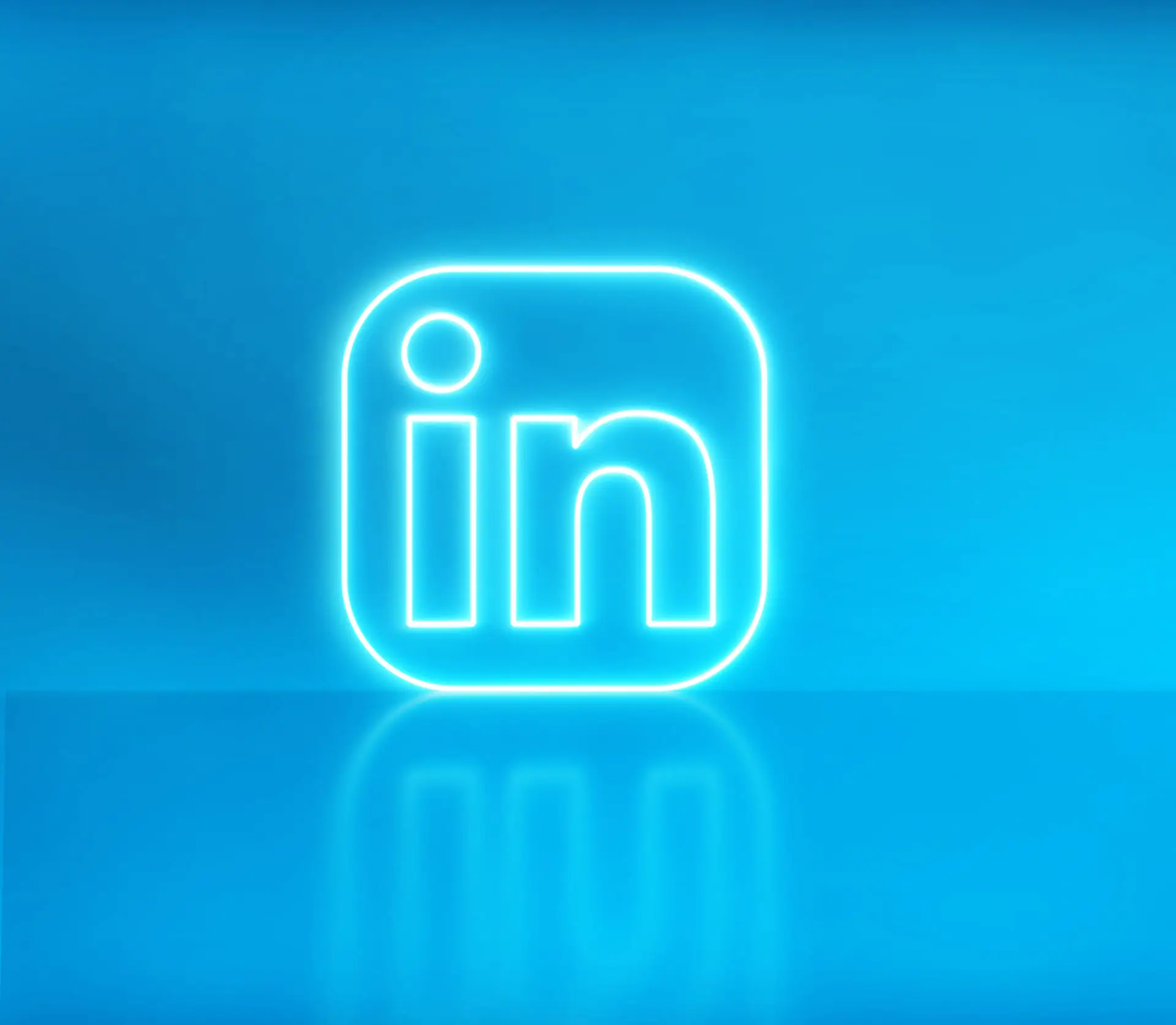 Are You Making the Most of LinkedIn Long Form Posts? This bright blue image shows a neon LinkedIn Icon button