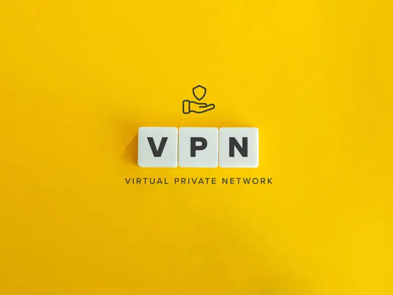 What is a VPN? this image shows a bright yellow backgroundwith 3x tiles with VPN spelled out on them